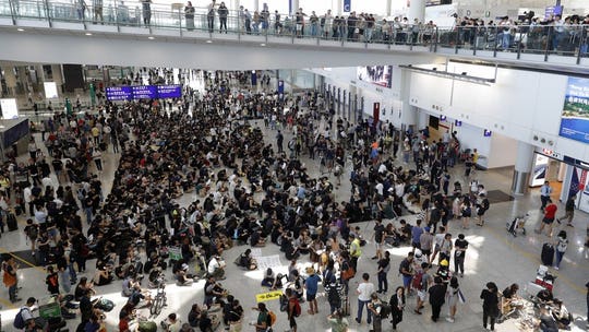 US, China spar over Hong Kong after ‘thuggish regime’ remarks as activists launch latest airport protest