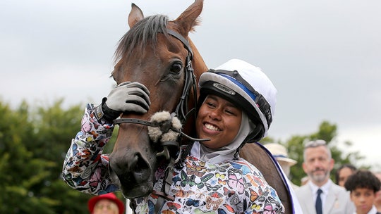 Hijab-wearing jockey becomes first female British Muslim to win a competitive race in UK