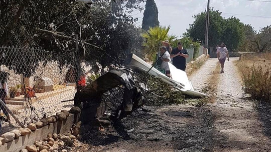 Sightseeing helicopter, small plane crash in midair over Spanish island of Mallorca; 7 dead