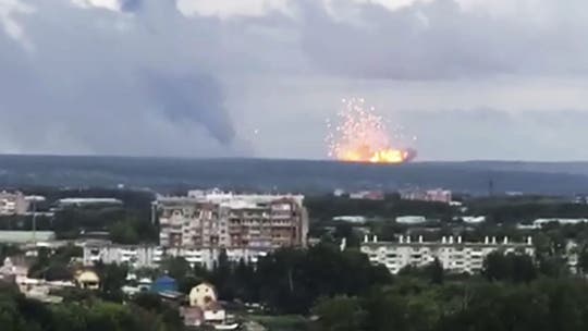 Fire at Siberian arms depot triggers massive explosions; 8 injured, one missing