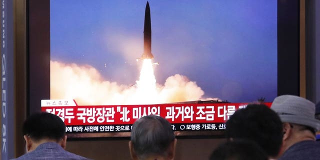 People watch a TV showing a file image of North Korea's missile launch during a news program at the Seoul Railway Station in Seoul, South Korea, Wednesday, July 31, 2019. (Associated Press)