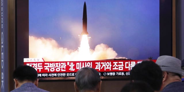 People watch a TV showing a file image of North Korea's missile launch during a news program at the Seoul Railway Station in Seoul, South Korea, Wednesday, July 31, 2019. (Associated Press)