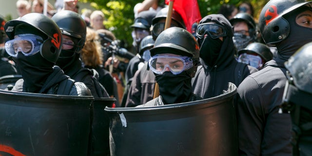 In this Aug. 4, 2018, file photo, counter-protesters prepare to clash with Patriot Prayer protesters during a rally in Portland, Ore. Portland police are mobilizing in hopes of avoiding clashes between out-of-state hate groups planning a rally Saturday and homegrown anti-fascists who say they’ll come out to oppose them.