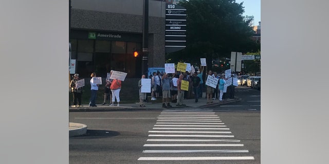 On the eve of President Trump's first campaign rally in New Hampshire since the 2016 election, Democrats protest the trip, in Manchester, NH on Wednesday, August 14, 2019