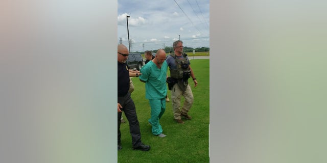 Curtis Watson being taken into custody after five days on the run following his prison escape.