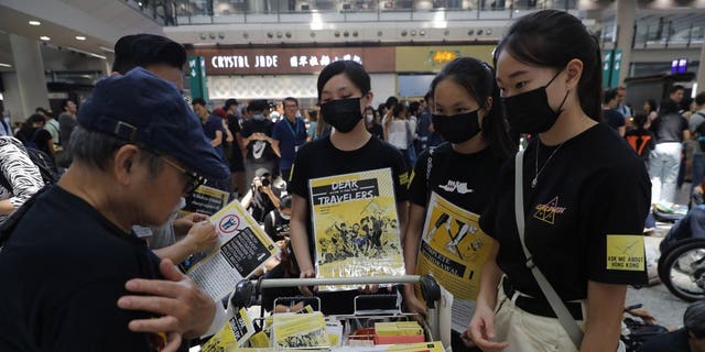 Protesters promote their cause at the airport In Hong Kong on Friday, Aug. 9, 2019. Pro-democracy protesters held a demonstration at Hong Kong's airport Friday even as the city sought to reassure visitors to the city after several countries issued travel safety warnings related to the increasing levels of violence surrounding the two-month-old protest movement.