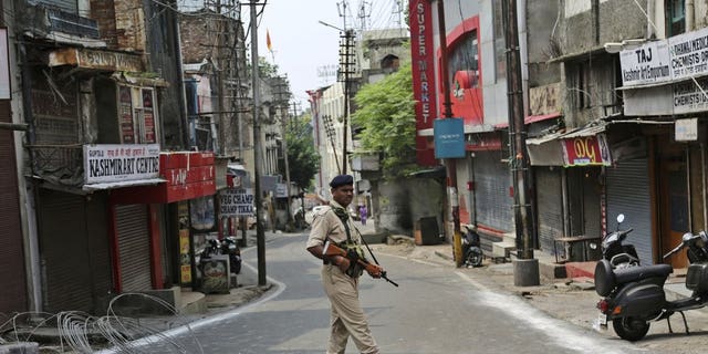 An Indian paramilitary soldier guards during security lockdown in Jammu, India, Tuesday, Aug.6, 2019. 