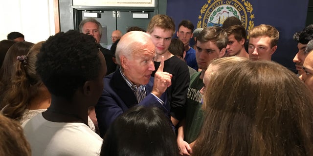 Former Vice President Joe Biden makes a point as he speaks with voters after holding a town hall at Dartmouth College in Hanover, N.H., on Aug. 23, 2019.