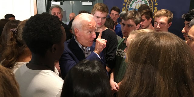 Former Vice President Joe Biden makes a point as he speaks with voters after holding a town hall at Dartmouth College in Hanover, N.H., on Aug. 23, 2019.