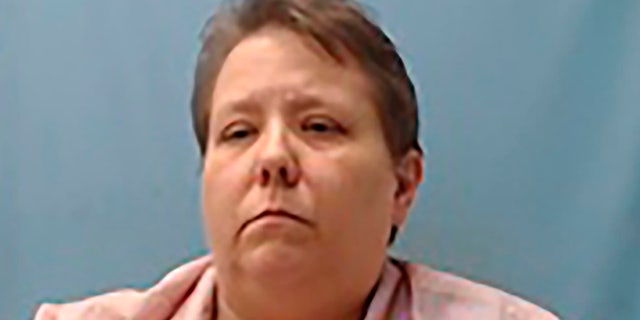 Jerri Kelly, 46, was arrested and hit with several charges after allegedly forcing four teenage boys who were fundraising to the ground and holding them at gunpoint.