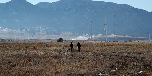 Hikers heading down a trail in the Rocky Flats National Wildlife Refuge in Broomfield, Colo., in November 2018. (AP Photo/David Zalubowski, File)