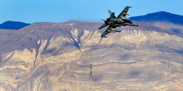 FILE: An F/A-18D Hornet from the VX-9 Vampire squadron at Naval Air Weapons Station China Lake, flies out of what is known as Star Wars Canyon toward the Panamint range in Death Valley National Park, Calif.