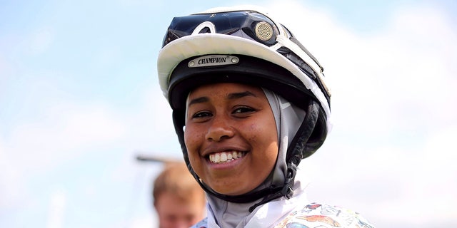 British Jockey Khadijah Mellah poses for a photo, prior to the all-female Magnolia Cup - an amateur jockey's charity race, during day three of the Qatar Goodwood Festival at Goodwood Racecourse, in Chichester, England, Thursday, Aug. 1, 2019. 