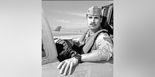 This undated photo provided Friday by the U.S. Navy shows Lt. Charles Z. Walker, 33, the pilot killed in the crash of a fighter jet in the California desert. (U.S. Navy via AP)