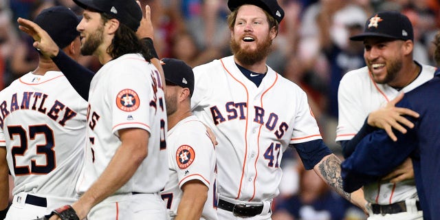 Houston Astros relief pitcher Chris Devenski, second from right, and teammates celebrate the team's 9-0 win over the Seattle Mariners, with a four-pitcher combined no-hitter, in a baseball game Saturday, Aug. 3, 2019, in Houston. (Associated Press)
