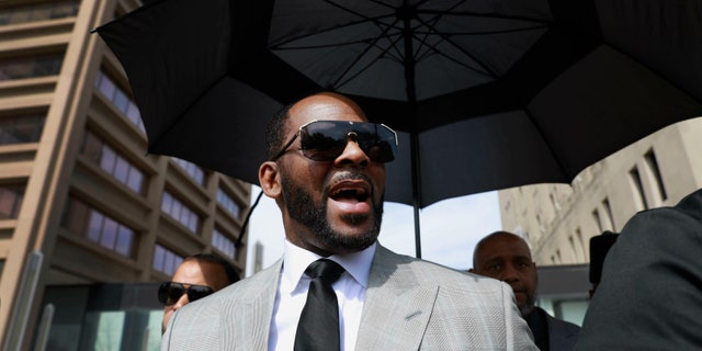 In this June 6, 2019, photo, musician R. Kelly leaves the Leighton Criminal Court building in Chicago. Minnesota authorities charged singer R. Kelly on Monday, Aug. 5, 2019, with two counts of prostitution and solicitation involving a girl under 18 in 2001. (AP Photo/Amr Alfiky, File)