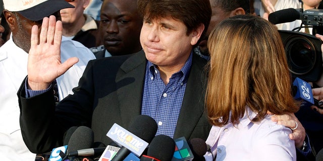In this March 14, 2012, file photo, former Illinois Gov. Rod Blagojevich, with his wife Patti at his side, speaks to the media in Chicago before reporting to federal prison in Denver. President Donald Trump says he's "very strongly" considering commuting the sentence of Blagojevich, who is serving a 14-year prison term on multiple federal corruption convictions. (AP Photo/M. Spencer Green, File)
