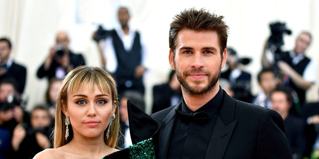 Miley Cyrus, left, and Liam Hemsworth attend the Metropolitan Museum of Art's Costume Institute benefit gala in New York, May 6, 2019. (Associated Press)