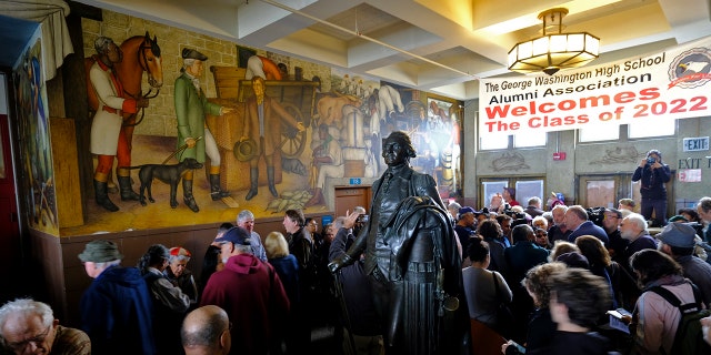 People fill the main entryway of George Washington High School to view the controversial 13-panel, 1,600-square foot mural, the "Life of Washington," during an open house for the public in San Francisco, Aug. 1, 2019. (Associated Press)
