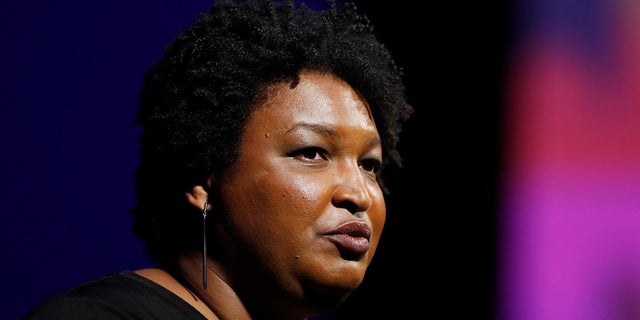 This July 22, 2019, file photo shows former Georgia House Minority Leader Stacey Abrams addressing the 110th NAACP National Convention, in Detroit.  (AP Photo/Carlos Osorio)