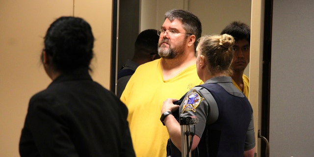 Steven Downs is led into a courtroom for arraignment in Anchorage, Alaska, Aug. 6, 2019. (Associated Press)