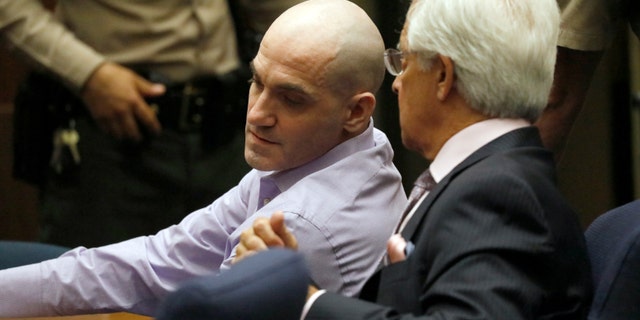 Michael Gargiulo, left, and his attorney Daniel Nardoni confer as Gargiulo's guilty verdicts on all counts are read in Los Angeles Superior Court Thursday, Aug. 15, 2019. A jury found Gargiulo guilty of fatally stabbing two women and attempting to kill a third in their Southern California homes. Gargiulo, is also awaiting trial for a similar killing in Illinois in 1993. (Al Seib/Los Angeles Times via AP, Pool)