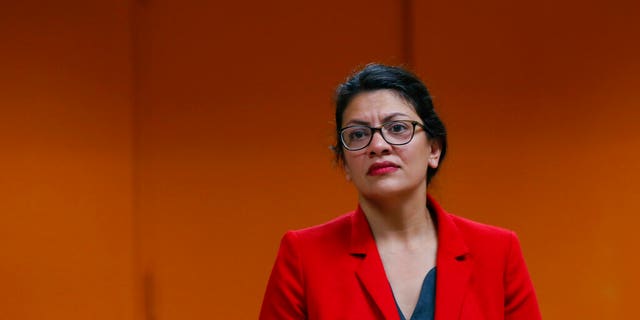 U.S. Rep. Rashida Tlaib, D-Mich., listens to a constituent in Wixom, Mich., Thursday, Aug. 15, 2019. (AP Photo/Paul Sancya)