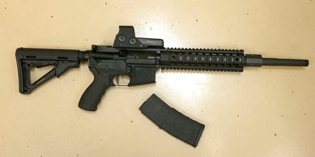 A custom-made semi-automatic hunting rifle with a detachable magazine, displayed at TDS Guns in Rocklin, Calif.
