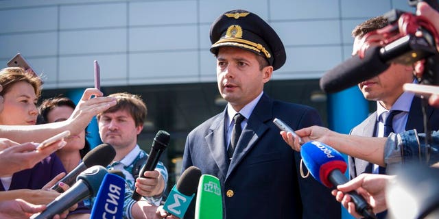 Damir Yusupov, 41-year-old Russian pilot, speaks to the media in Yekaterinburg, Russia, Friday, Aug. 16, 2019. 