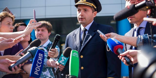 Damir Yusupov, 41-year-old Russian pilot, speaks to the media in Yekaterinburg, Russia, Friday, Aug. 16, 2019.