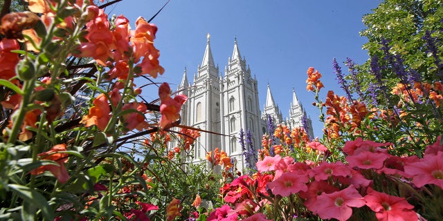 Flowers bloom in front of the Salt Lake Temple, at Temple Square, in Salt Lake City.