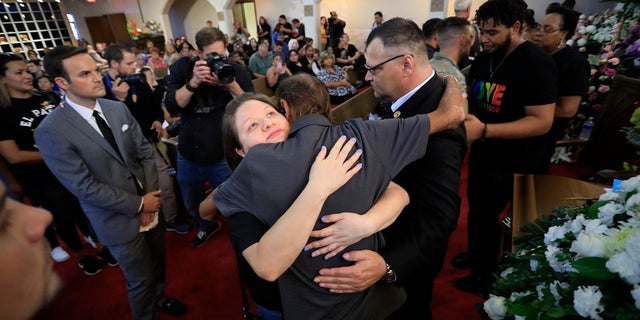 Antonio Basco, center, at her funeral Friday. (AP Photo/Jorge Salgado)