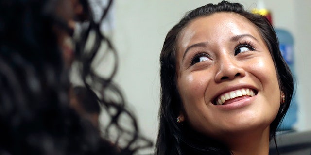 Evelyn Hernandez, 21, smiles in court after being acquitted on charges of aggravated homicide in her retrial related to the loss of a pregnancy in 2016, in Ciudad Delgado on the outskirts of San Salvador, El Salvador, Monday, Aug. 19, 2019. 
