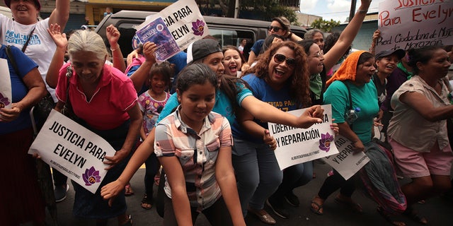 Women and girls celebrate outside court where Evelyn Hernandez was acquitted on charges of aggravated homicide in her retrial related to the loss of a pregnancy in 2016, in Ciudad Delgado on the outskirts of San Salvador, El Salvador, Monday, Aug. 19, 2019. 