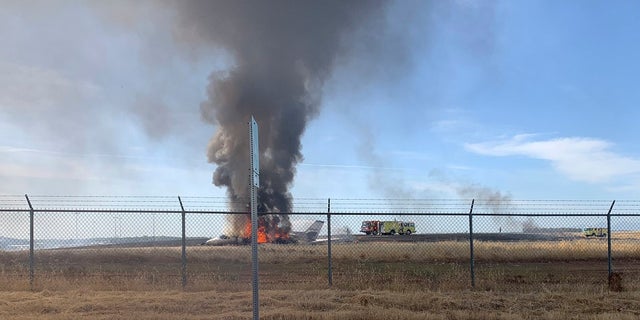 The aircraft slid off the end of the runway into the grass and caught fire. (California Highway Patrol via AP)