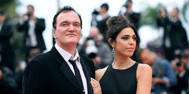 FILE - In this May 18, 2019 file photo, film director Quentin Tarantino and his wife Daniela Pick pose for photographers upon arrival at the premiere of the film "The Wild Goose Lake" at the 72nd international film festival, Cannes, southern France. Tarantino is about to become a father. His representative Katherine Rowe says the “Once Upon a Time... In Hollywood” director and his wife, Israeli model and singer Pick, are expecting a baby. The couple met in 2009 and married last November. It’s the first child for the 56-year-old Tarantino, who also directed “Pulp Fiction” and “Reservoir Dogs,” and the 35-year-old Pick. (Photo by Arthur Mola/Invision/AP, File)