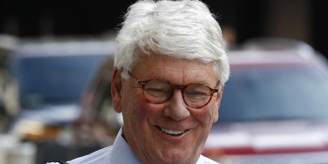 Greg Craig, former White House counsel to former President Barack Obama, walks into a federal courthouse for his trial, Thursday, Aug. 22, 2019, in Washington. (AP Photo/Patrick Semansky)