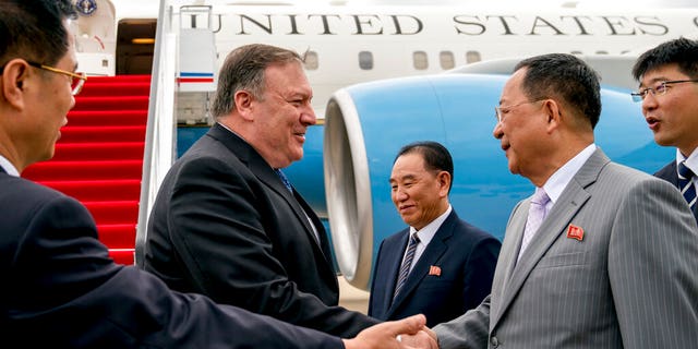 In this July 6, 2018, file photo, U.S. Secretary of State Mike Pompeo, second from left, is greeted by North Korean Director of the United Front Department Kim Yong Chol, center, and North Korean Foreign Minister Ri Yong Ho, second from right, as he arrives at Sunan International Airport in Pyongyang, North Korea.