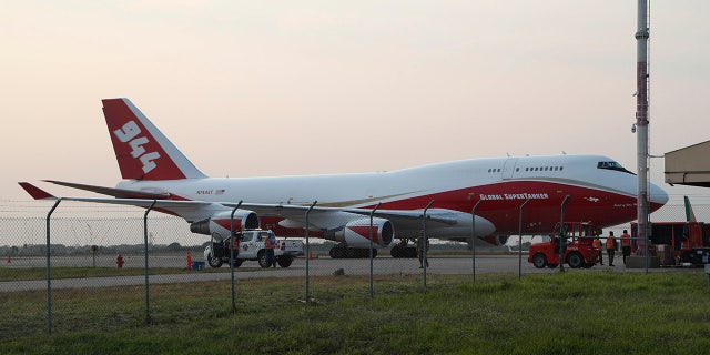 A Boeing 747-400 Global SuperTanker, stands on the tarmac before it starts firefighting operations, at the Viru Viru airport in Santa Cruz, Bolivia, Friday, Aug. 23, 2019. Bolivia, along with Brazil, is struggling to contain wildfires, many believed to have been set by farmers clearing land for cultivation. (AP Photo/Juan Karita)