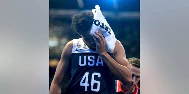 United States Derrick White walks off the court with a head injury during their exhibition basketball game against Australia in Melbourne, Saturday, Aug. 24, 2019. (AP Photo/Andy Brownbill)