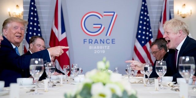 U.S. President Donald Trump, left, and Britain's Prime Minister Boris Johnson attend a working breakfast at the Hotel du Palais on the sidelines of the G-7 summit in Biarritz, France, Sunday, Aug. 25, 2019. (Associated Press)