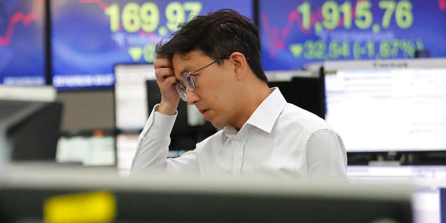 China announces it seeks 'calm' end to trade war, as markets tank and currency hits 11-year flatline AP19238053861722