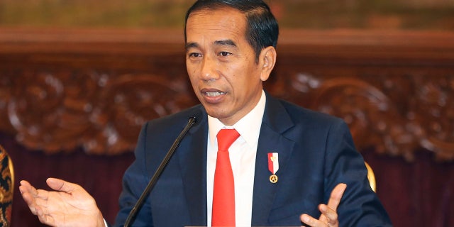 Indonesia President Joko Widodo gestures as he speaks during a press conference at the palace in Jakarta, Indonesia, Monday, Aug. 26, 2019.