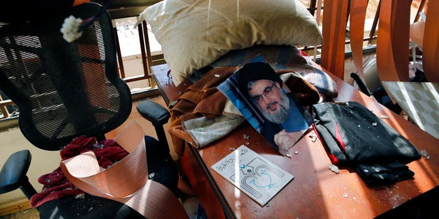 Aug. 25, 2019: Hezbollah leader Sayyed Hassan Nasrallah lies amid other damage inside the Lebanese Hezbollah media office, in a southern suburb of Beirut, Lebanon. The long shadow war between Israel and Iran has burst into the open in recent days, with Israel allegedly striking Iran-linked targets as far away as Iraq and crash-landing two drones in Lebanon. These incidents, along with an air raid in Syria that Israel says thwarted an imminent Iranian drone attack, have raised tensions at a particularly fraught time. (AP Photo/Bilal Hussein)