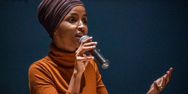 U.S. Rep. Ilhan Omar speaks at a town hall in South Minneapolis on ICE and the administration's immigration detention policies, at the Colin Powell Center in Minneapolis on Tuesday, Aug. 27, 2019. (Richard Tsong-Taatarii/Star Tribune via AP)