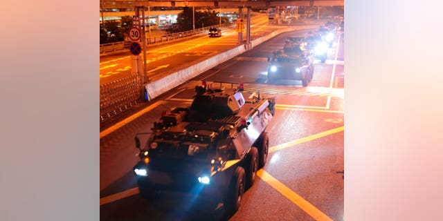 Armored personnel carriers of China's People's Liberation Army (PLA) pass through the Huanggang Port border between China and Hong Kong, Thursday, Aug. 29, 2019.