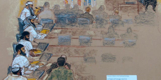 This Wednesday, Jan. 21, 2009 sketch reviewed by the U.S. military, shows, from top left, Khalid Shaikh Mohammad; Walid bin Attash; Ramzi bin al Shibh; Ali Abdul Aziz Ali, also known as Ammar al Baluchi, and Mustafa al Hawsawi attend a hearing at the U.S. Military Commissions court for war crimes at the U.S. Naval Base in Guantanamo Bay, Cuba. On Friday, Aug. 30, 2019, a military judge set Jan. 11, 2021 for the start of the long-stalled war crimes trial of the five men being held at the Guantanamo Bay prison on charges of planning and aiding the Sept. 11 terrorist attacks. (AP Photo/Janet Hamlin, Pool)