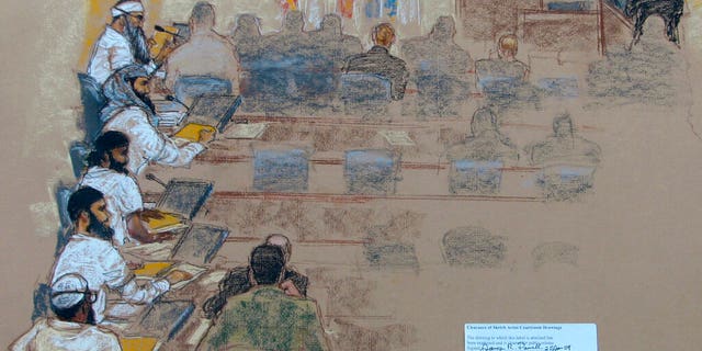 This Wednesday, Jan. 21, 2009 sketch reviewed by the U.S. military, shows, from top left, Khalid Shaikh Mohammad; Walid bin Attash; Ramzi bin al Shibh; Ali Abdul Aziz Ali, also known as Ammar al Baluchi, and Mustafa al Hawsawi attend a hearing at the U.S. Military Commissions court for war crimes at the U.S. Naval Base in Guantanamo Bay, Cuba. On Friday, Aug. 30, 2019, a military judge set Jan. 11, 2021 for the start of the long-stalled war crimes trial of the five men being held at the Guantanamo Bay prison on charges of planning and aiding the Sept. 11 terrorist attacks. (AP Photo/Janet Hamlin, Pool)