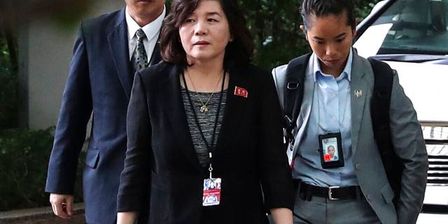 In this June 11, 2018, file photo, North Korean Vice Foreign Minister Choe Son Hui, center, arrives for a meeting with U.S. Ambassador to the Philippines Sung Kim at the Ritz-Carlton Millenia Hotel in Singapore ahead of the summit between U.S. President Donald Trump and North Korean leader Kim Jong Un.