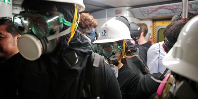 Protestors travel in a train en route to Causeway Bay in Hong Kong.